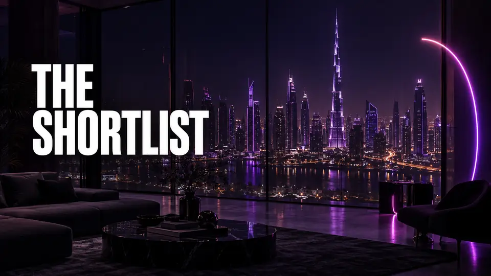 A small shortlisting meeting around a laptop showing vendor logos, Dubai skyline visible through the window behind them